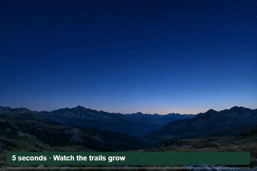 A photographic mountain landscape beneath a simulated sky of curved star trails.